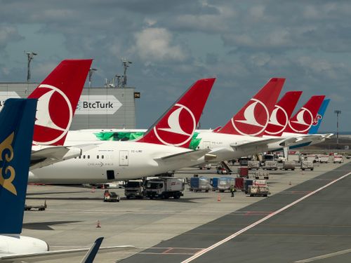 Free Row of Turkish Airlines planes parked at Istanbul airport ready for boarding. Stock Photo