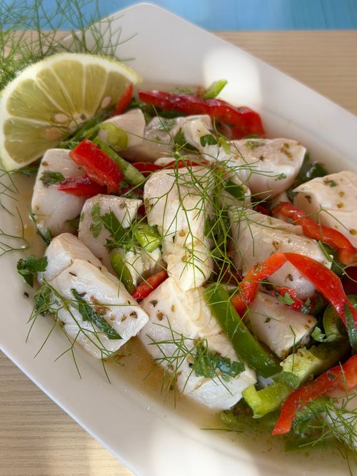 Free Vibrant ceviche with fresh fish, lemon, and peppers, garnished with herbs. Stock Photo