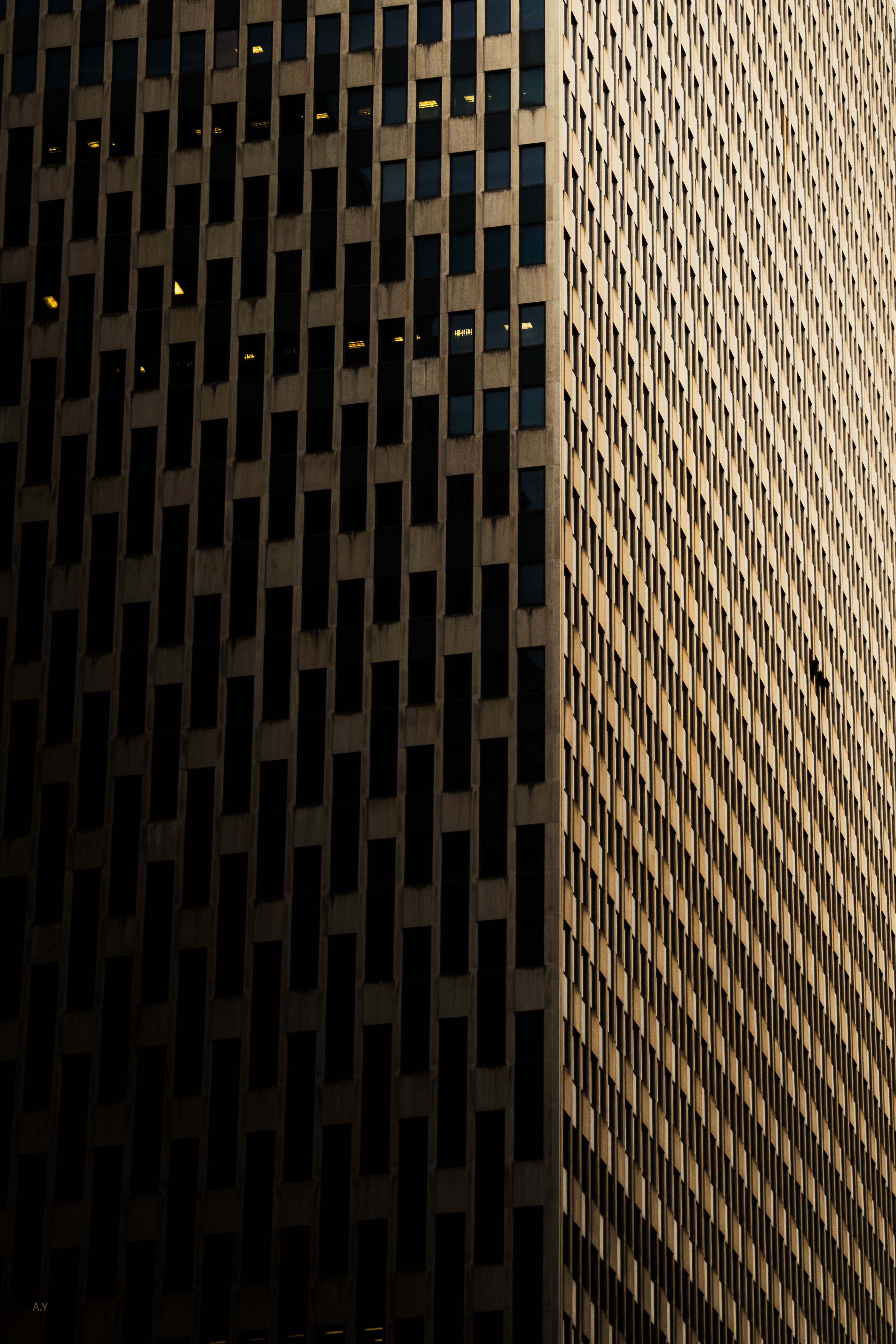 Dramatic view of a modern New York skyscraper with geometric patterns.