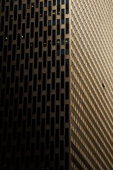 Dramatic view of a modern New York skyscraper with geometric patterns.