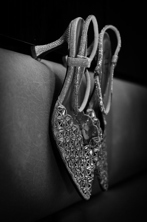 Free Black and white image of elegant high heel shoes with intricate floral design, perfect for fashion themes. Stock Photo