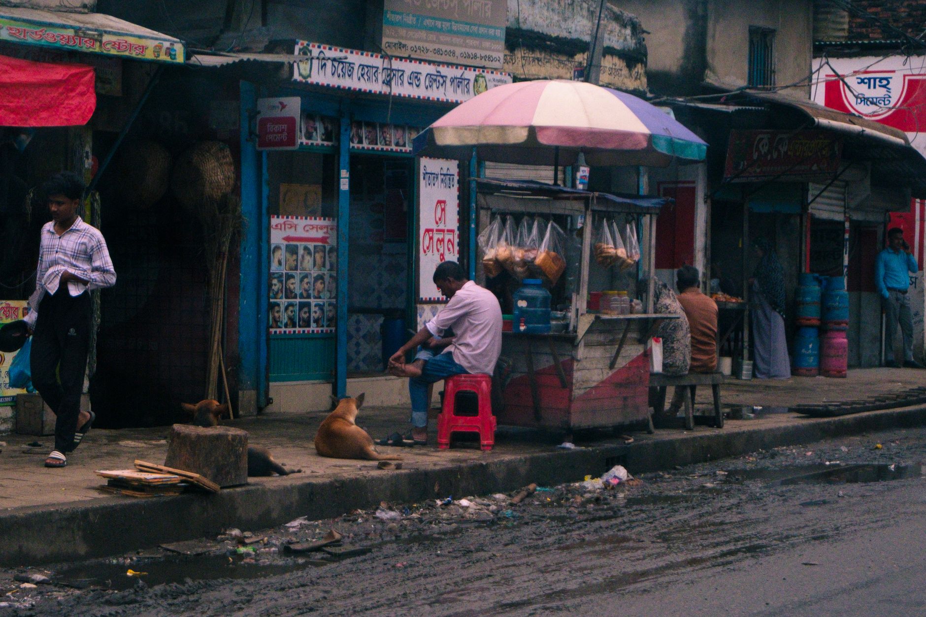 Quiet lane in Banglamphu with old shophouses and street vendors