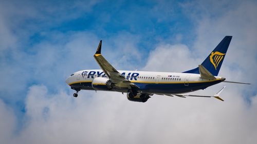 Free A Ryanair Boeing 737 jet soaring above the clouds during daytime. Stock Photo