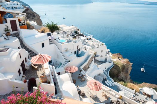 Beautiful view of Santorini's iconic white architecture and blue sea on a sunny day.