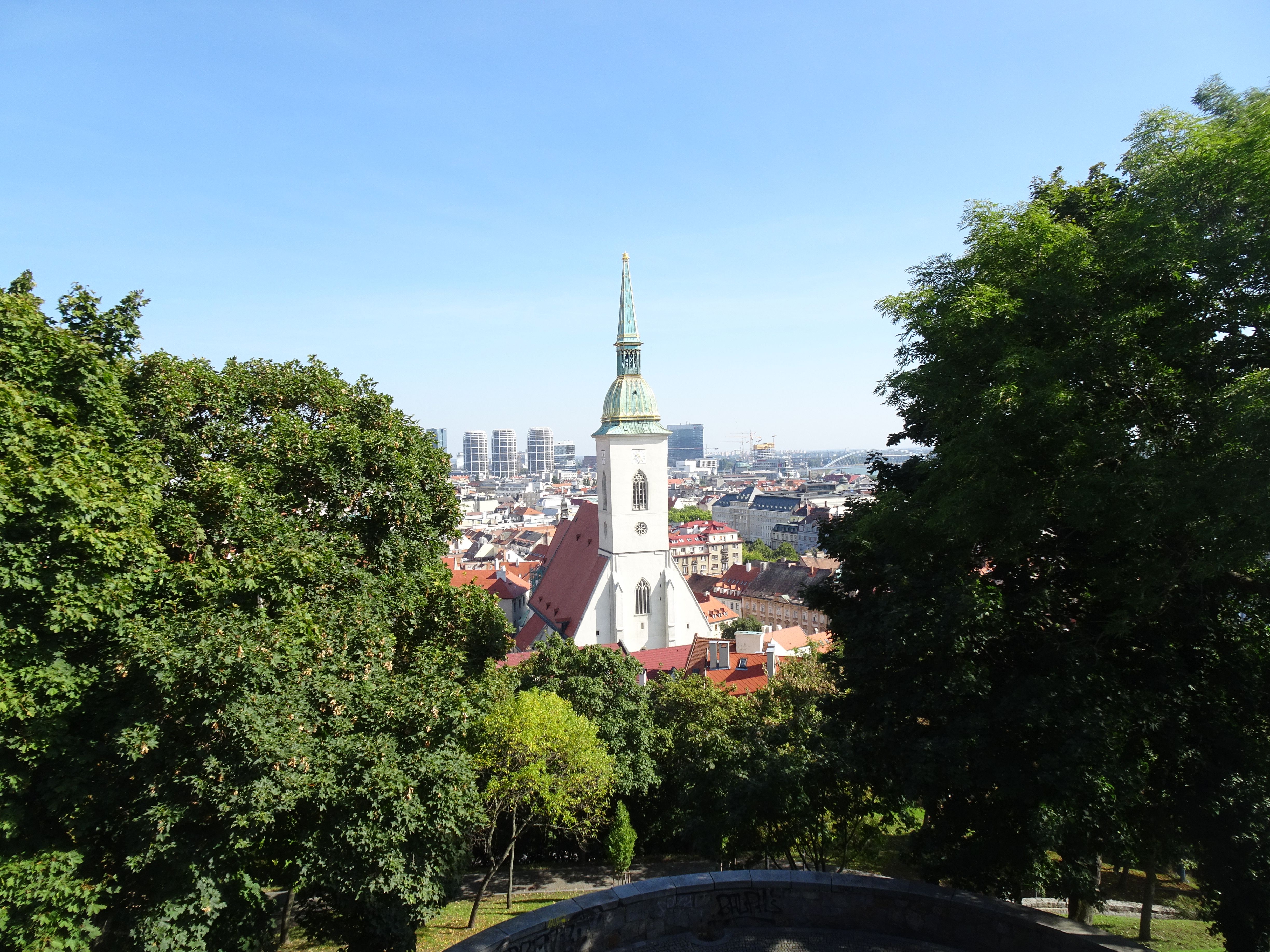 Stunning view of St. Martin's Cathedral amidst Bratislava's cityscape on a bright day.