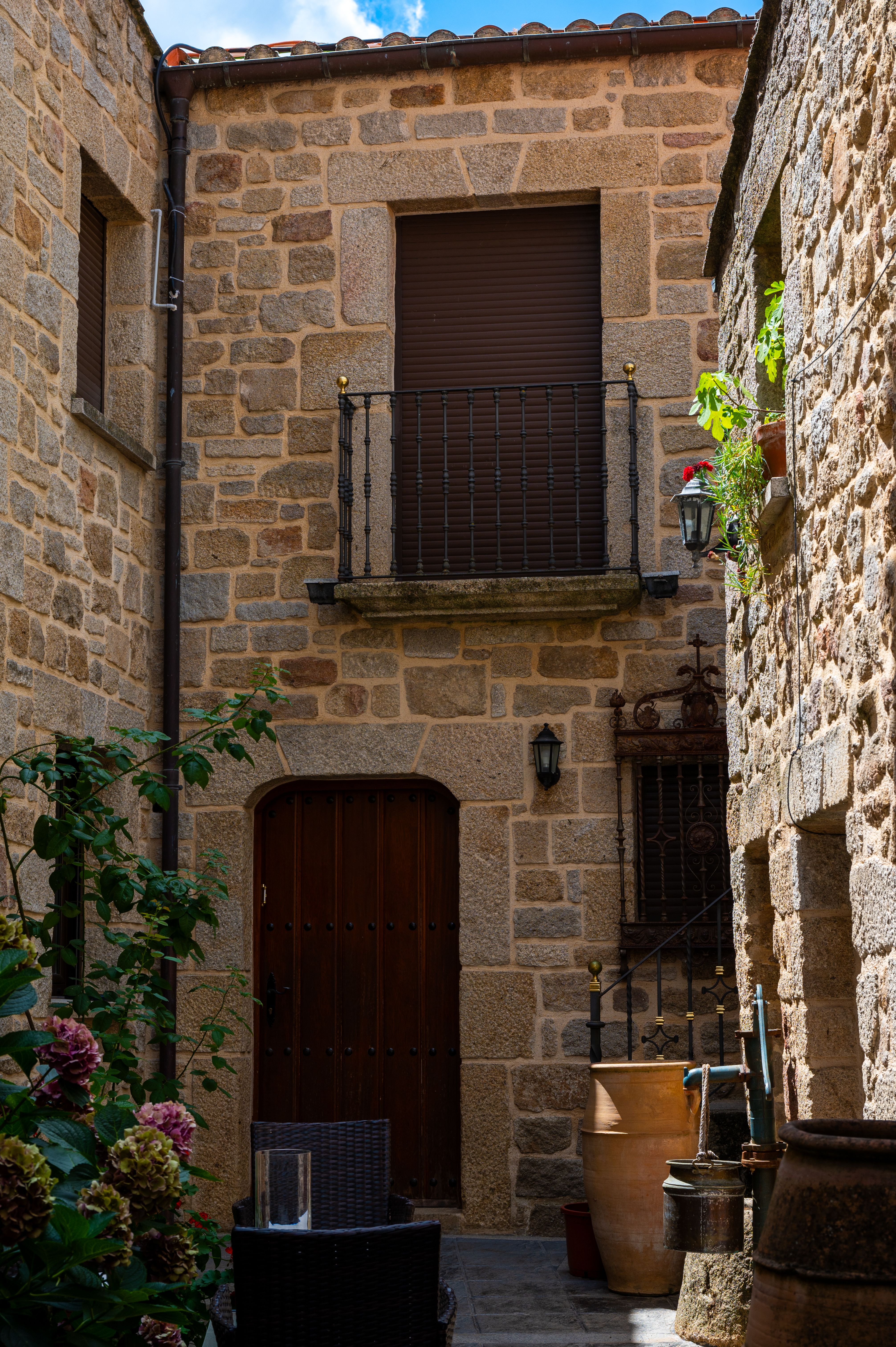 low stacked stone wall lining the edge of a small patio for permanent, durable privacy