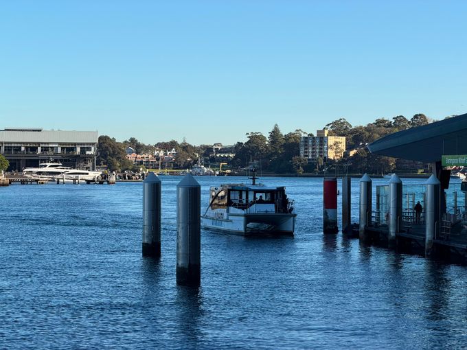 Passenger ferry tied up at a quiet dock under clear skies — photo by sasif awan on Pexels