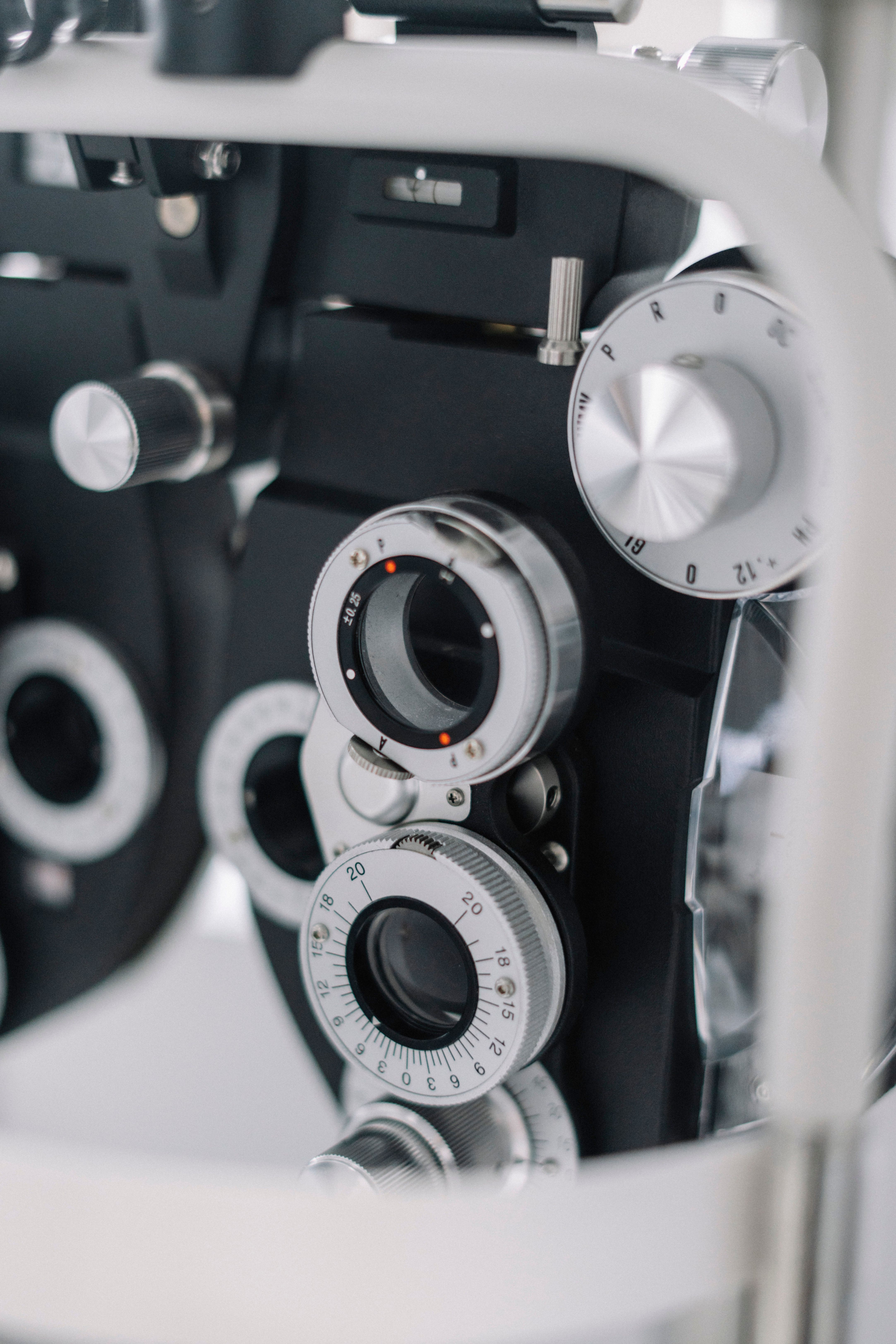 Detailed view of an optometry phoropter used for eye exams and vision tests.