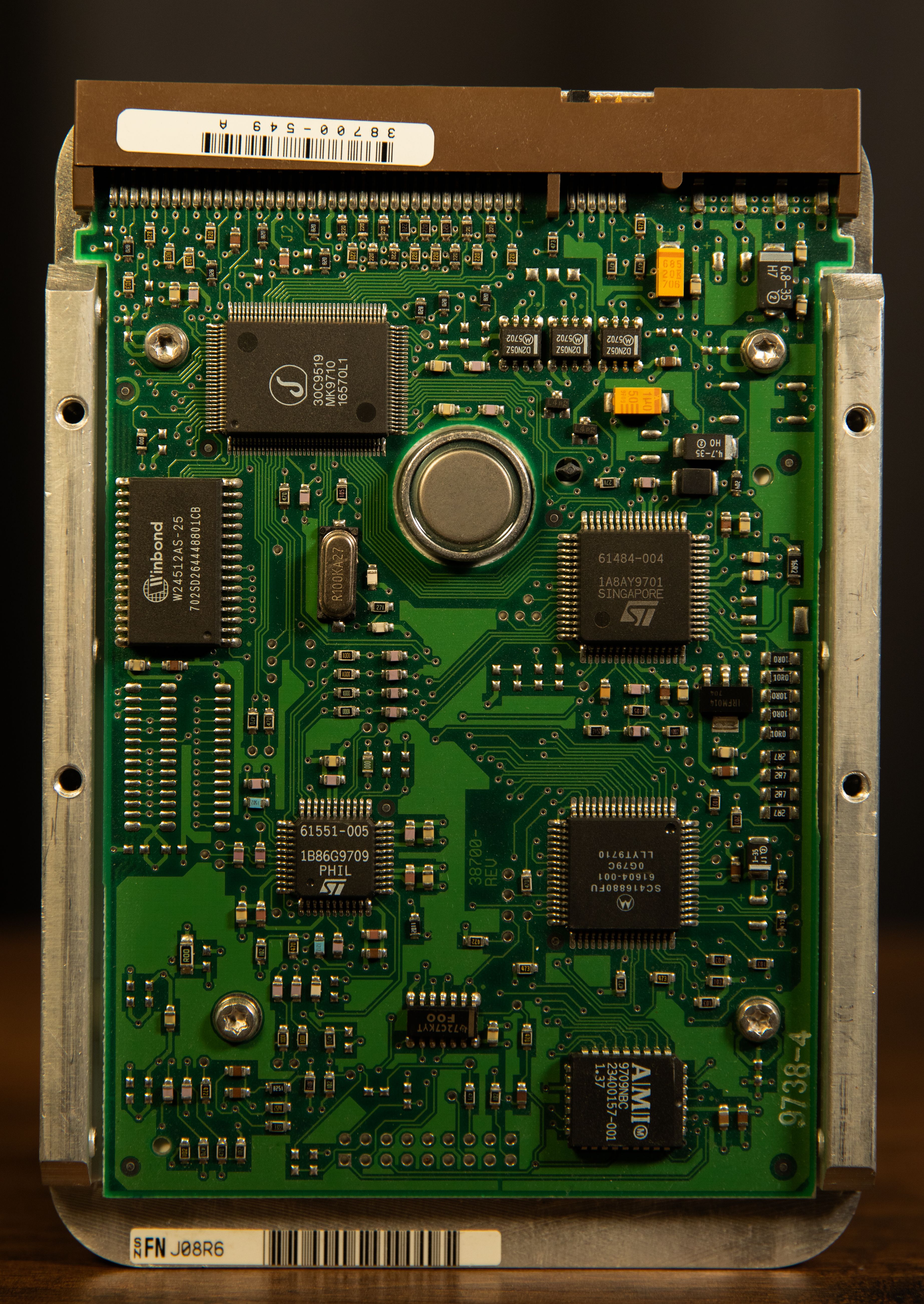 Detailed view of a computer hard drive circuit board showing integrated circuits and components.