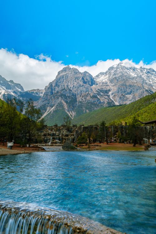Free Spectacular landscape of Jade Dragon Snow Mountain and Blue Moon Valley's turquoise waters. Stock Photo