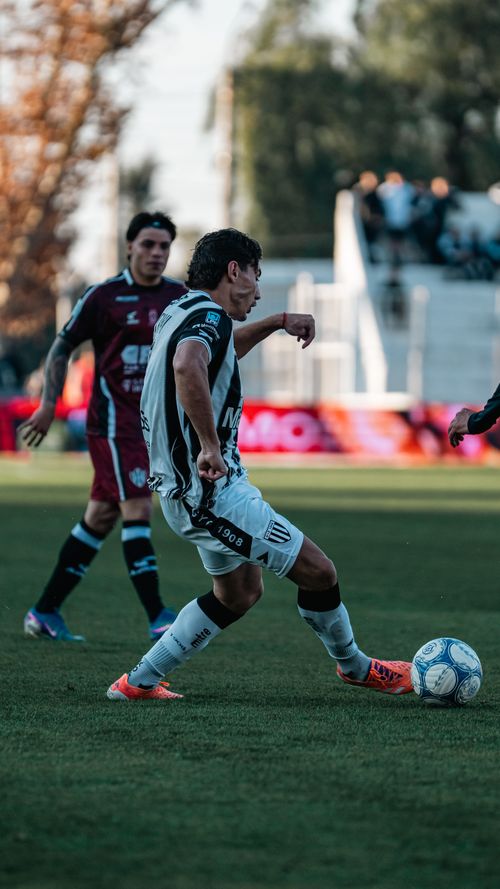 Free Soccer players in action during a competitive outdoor match, showcasing agility and skill. Stock Photo