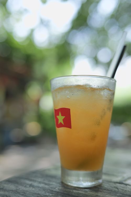 Free Close-up of a refreshing citrus beverage with ice and a straw, perfect for a hot summer day outdoors. Stock Photo