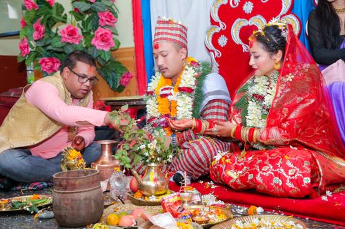 Free A vibrant traditional Nepali wedding ceremony featuring ornate attire, rituals, and cultural elements. Stock Photo