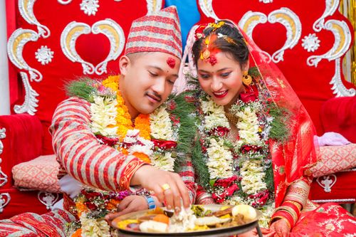 Free Colorful traditional Nepalese wedding capturing vibrant cultural attire and festive rituals. Stock Photo