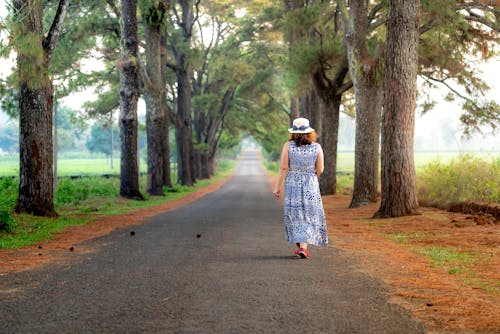 Photo Of Woman Walking On The Road