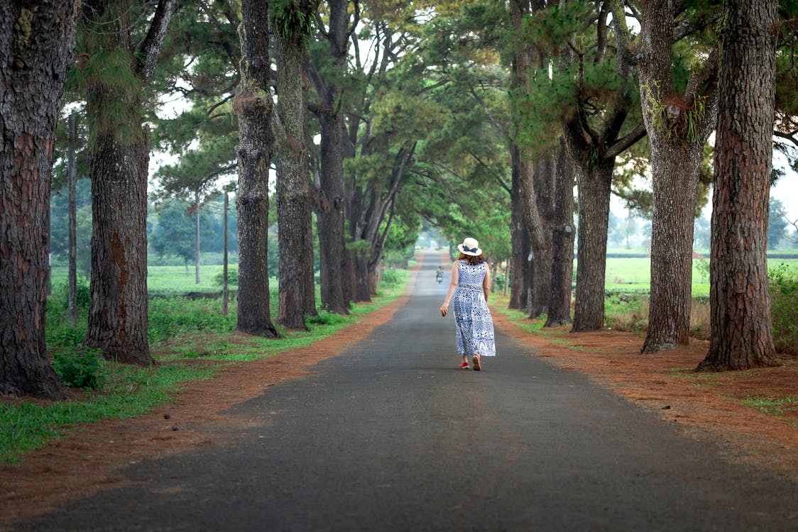 Photo Of Woman Walking On The Road