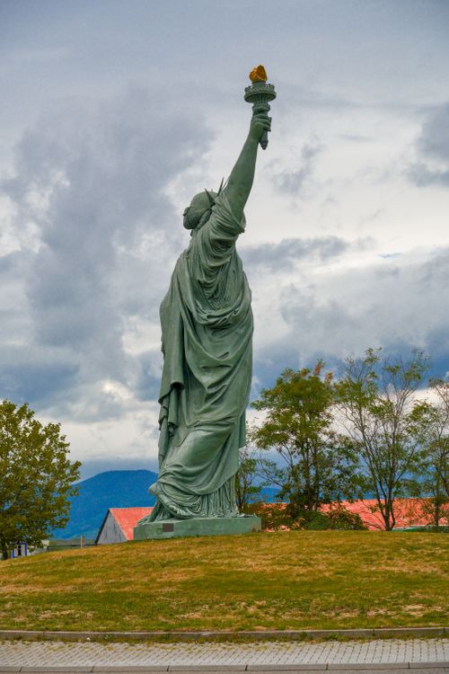 Free Stunning view of the Statue of Liberty replica in Colmar, France against a cloudy sky. Stock Photo