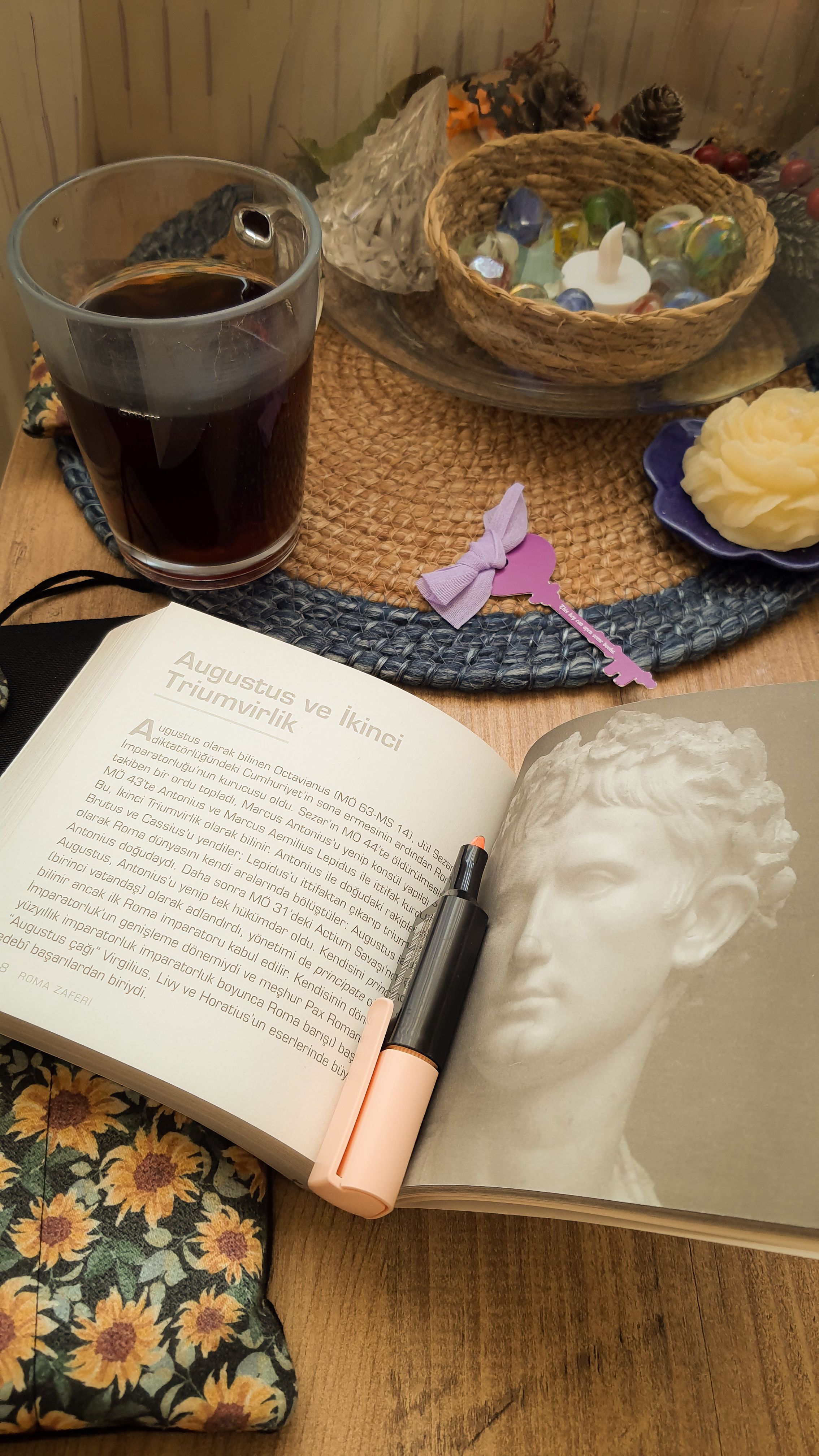 A warm setting with a book, coffee, and cozy accents perfect for a relaxing afternoon.
