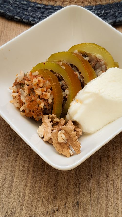 Free Appetizing stuffed bell peppers with rice, yogurt, and walnuts in a bowl. Stock Photo