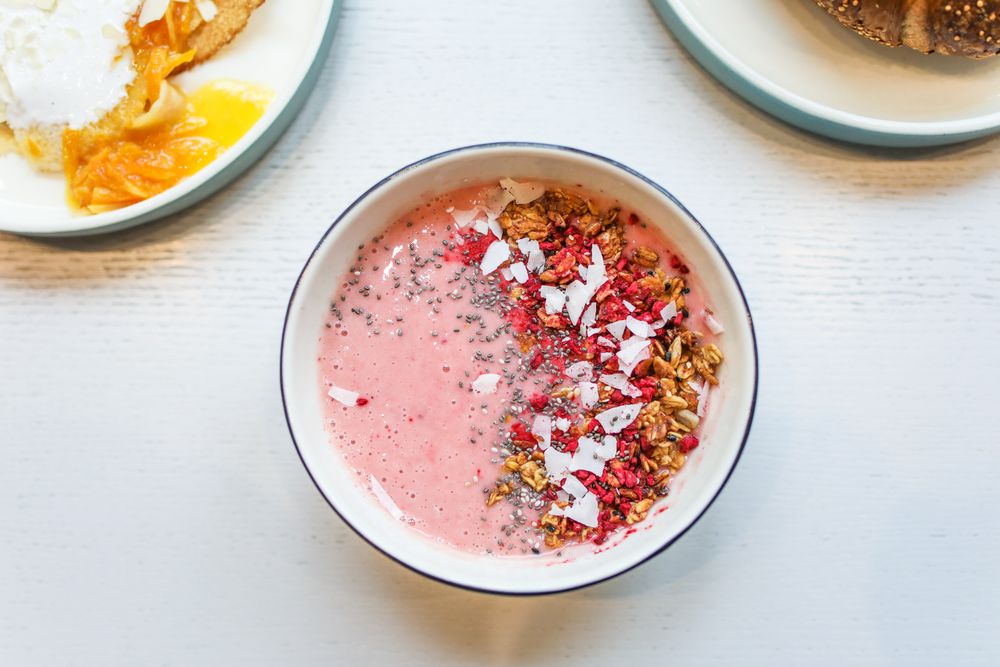 Vivid pink pitaya smoothie bowl