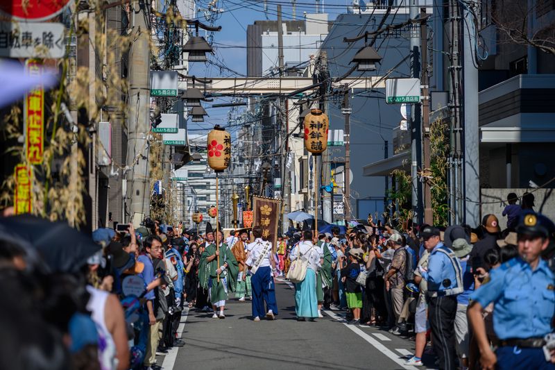 Crowd filling a street during a festival — Guohua Song on Pexels