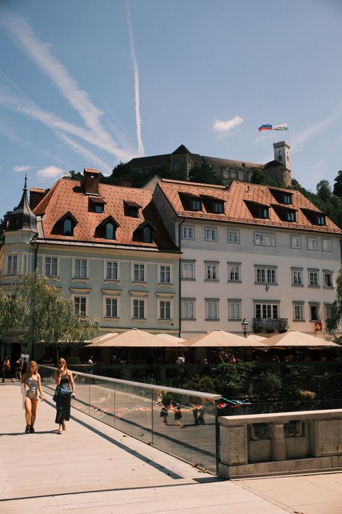 Free A sunny day in Ljubljana with the historic castle and quaint streetscape. Stock Photo