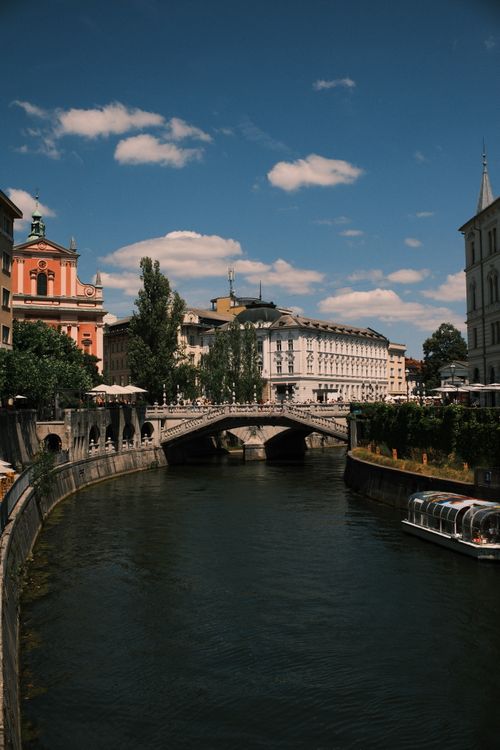 Free Explore the vibrant canals and historic architecture of Ljubljana in summer. Stock Photo