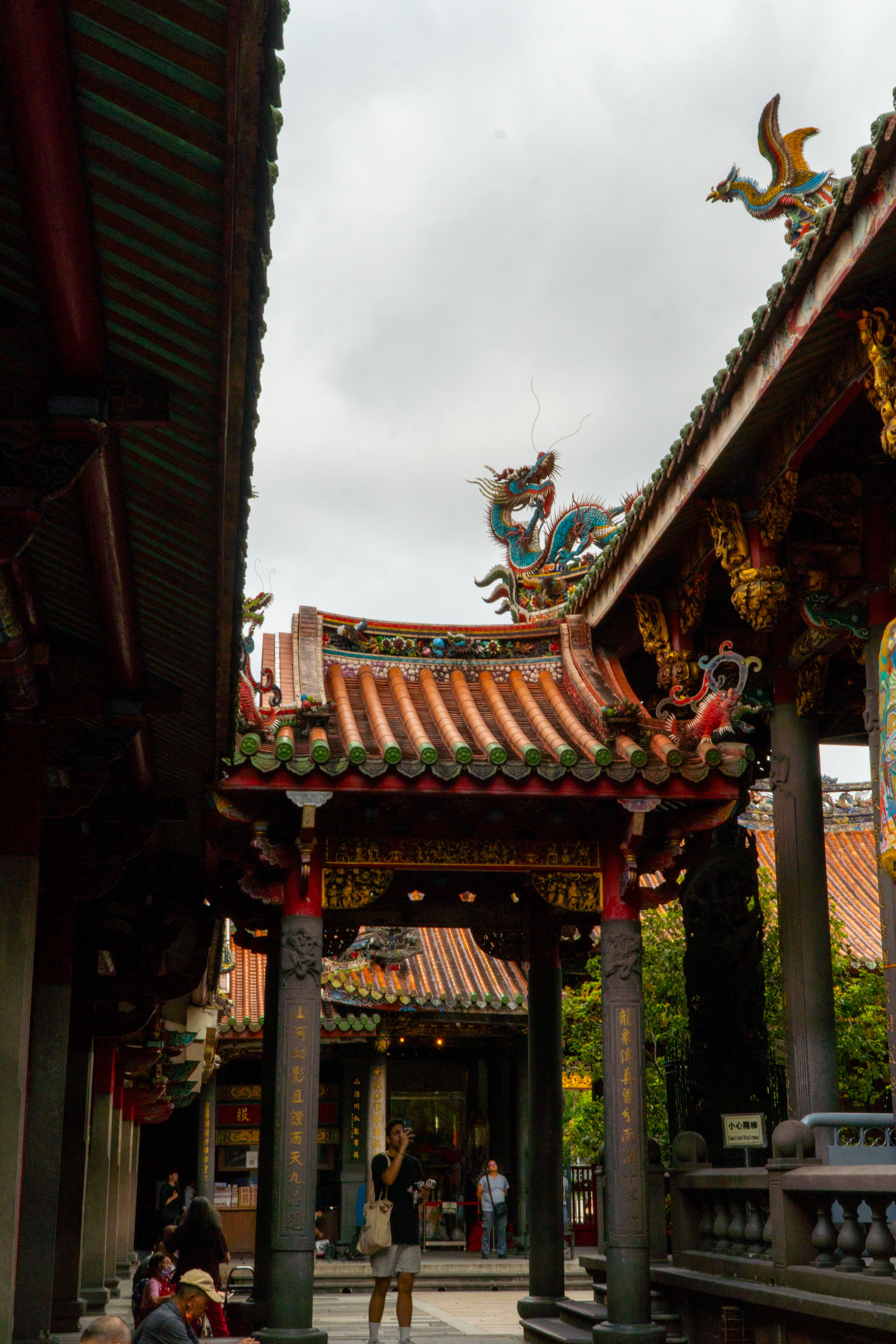 Ornate dragon roof carvings at a Taipei temple