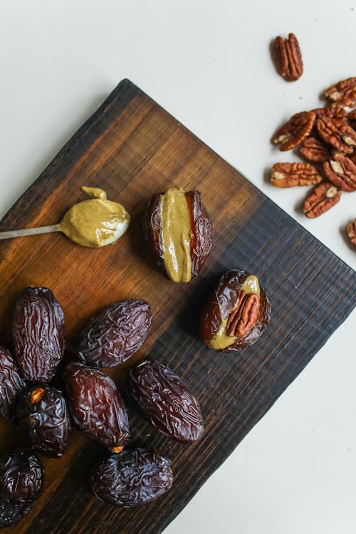 Photo Of Prunes On Wooden Surface