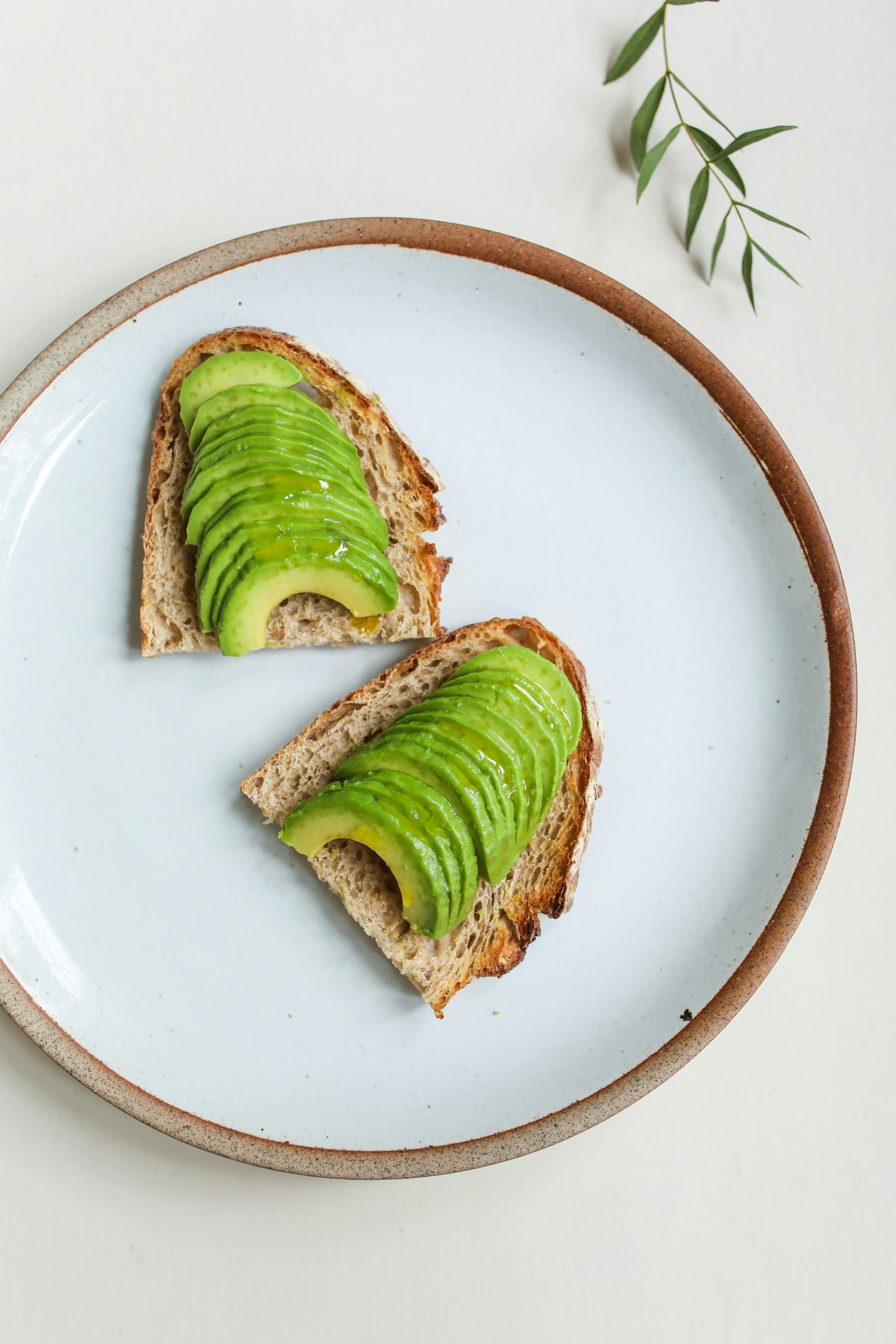 Photo Of An Avocado On Sliced Bread · Free Stock Photo