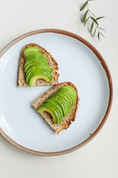 Minimalist image of sliced avocado on toast, ideal for food photography and health themes.