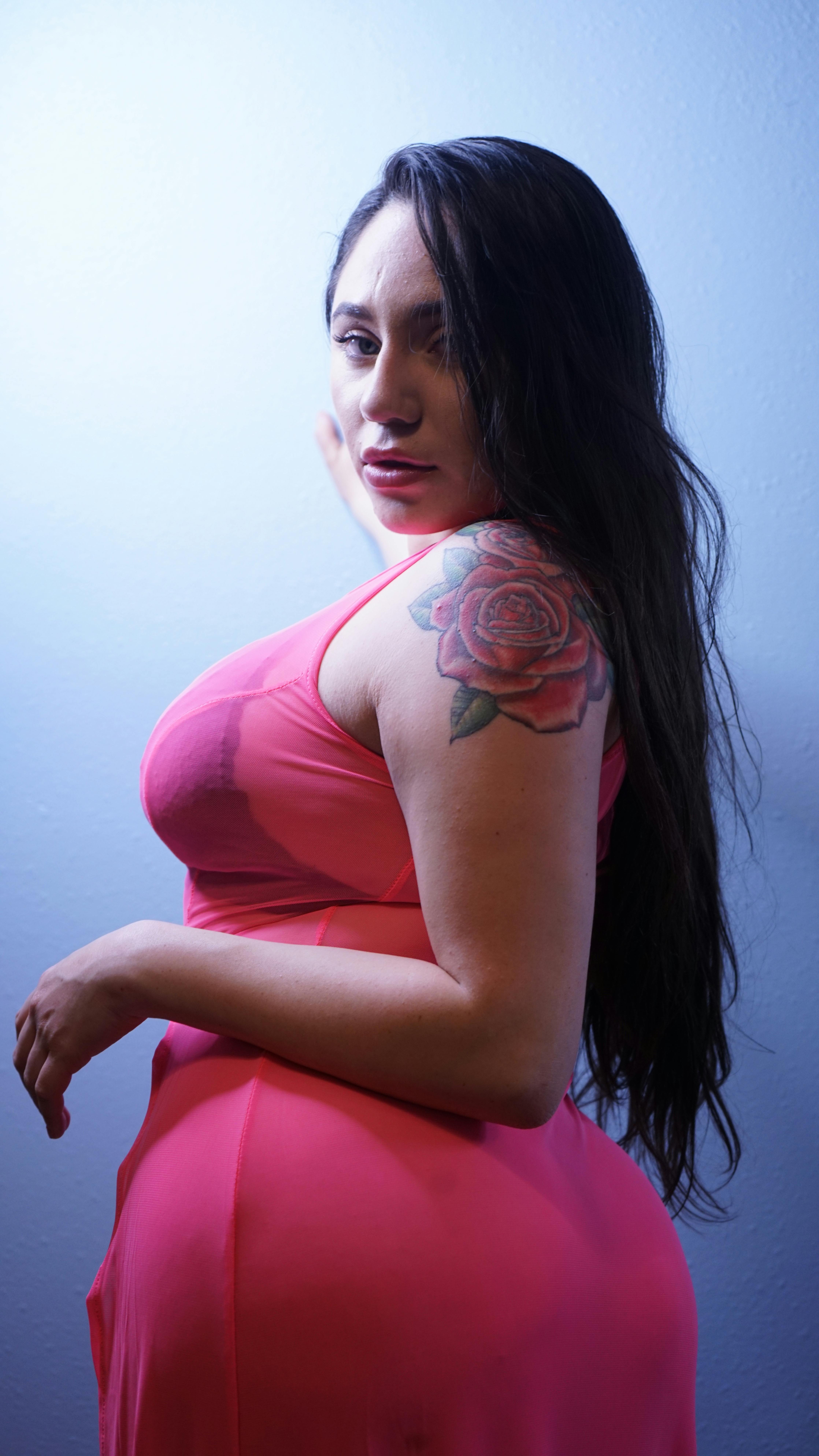 Woman holding a bowl of fruit and yogurt to support digestive health