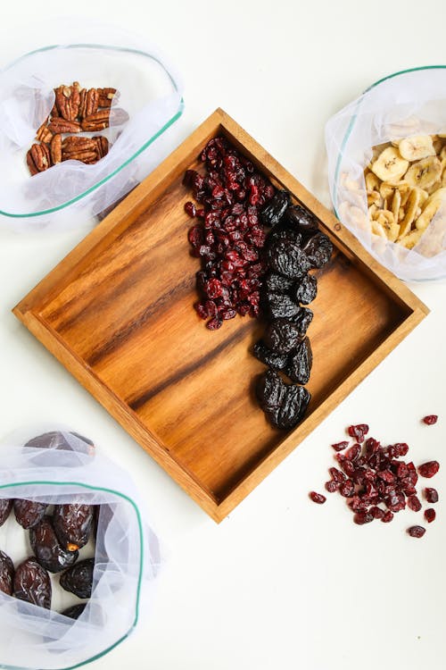 Photo Of Prunes On Wooden Tray