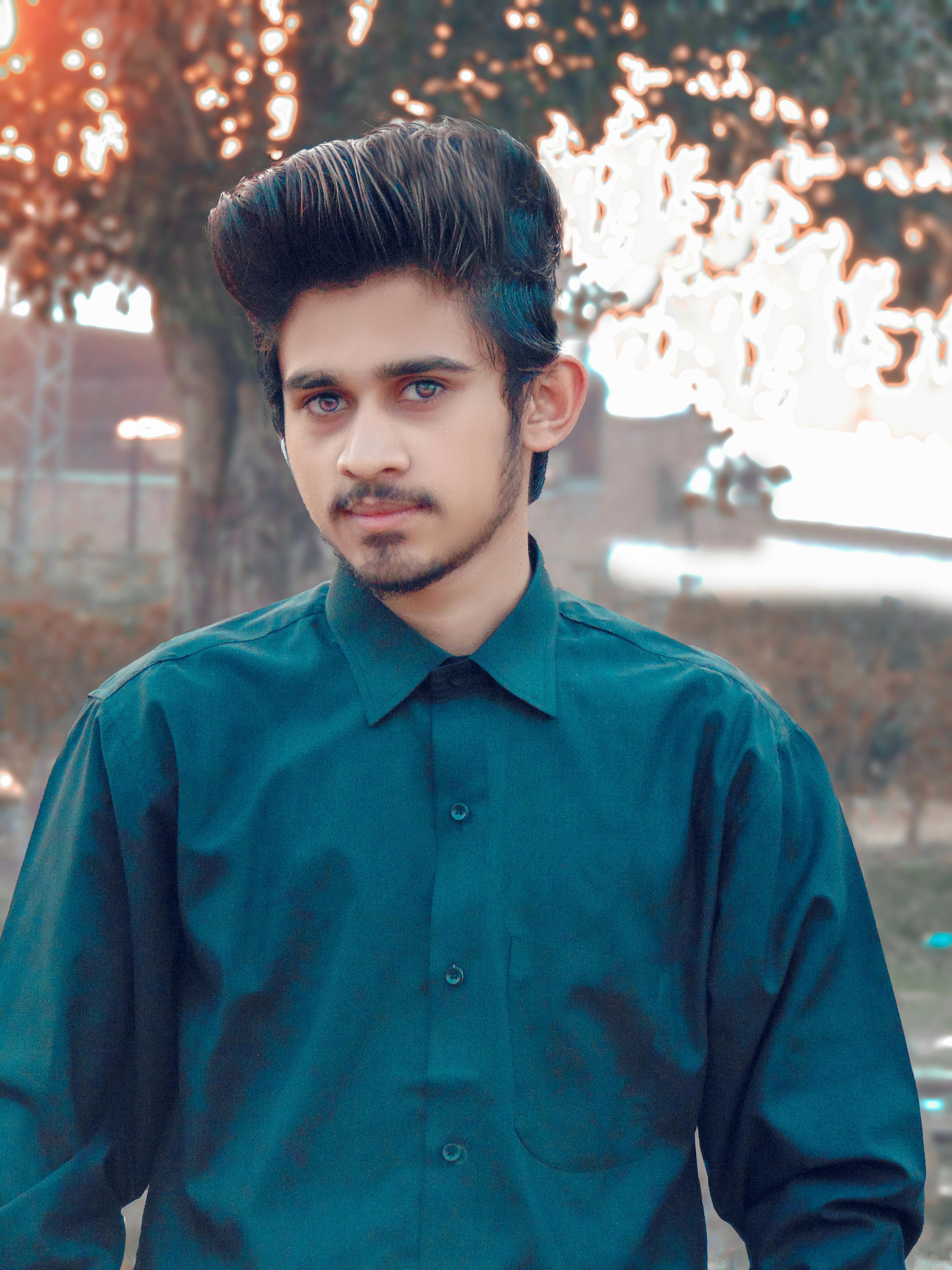 Tropical smoothie in a glass with mango and pineapple garnish