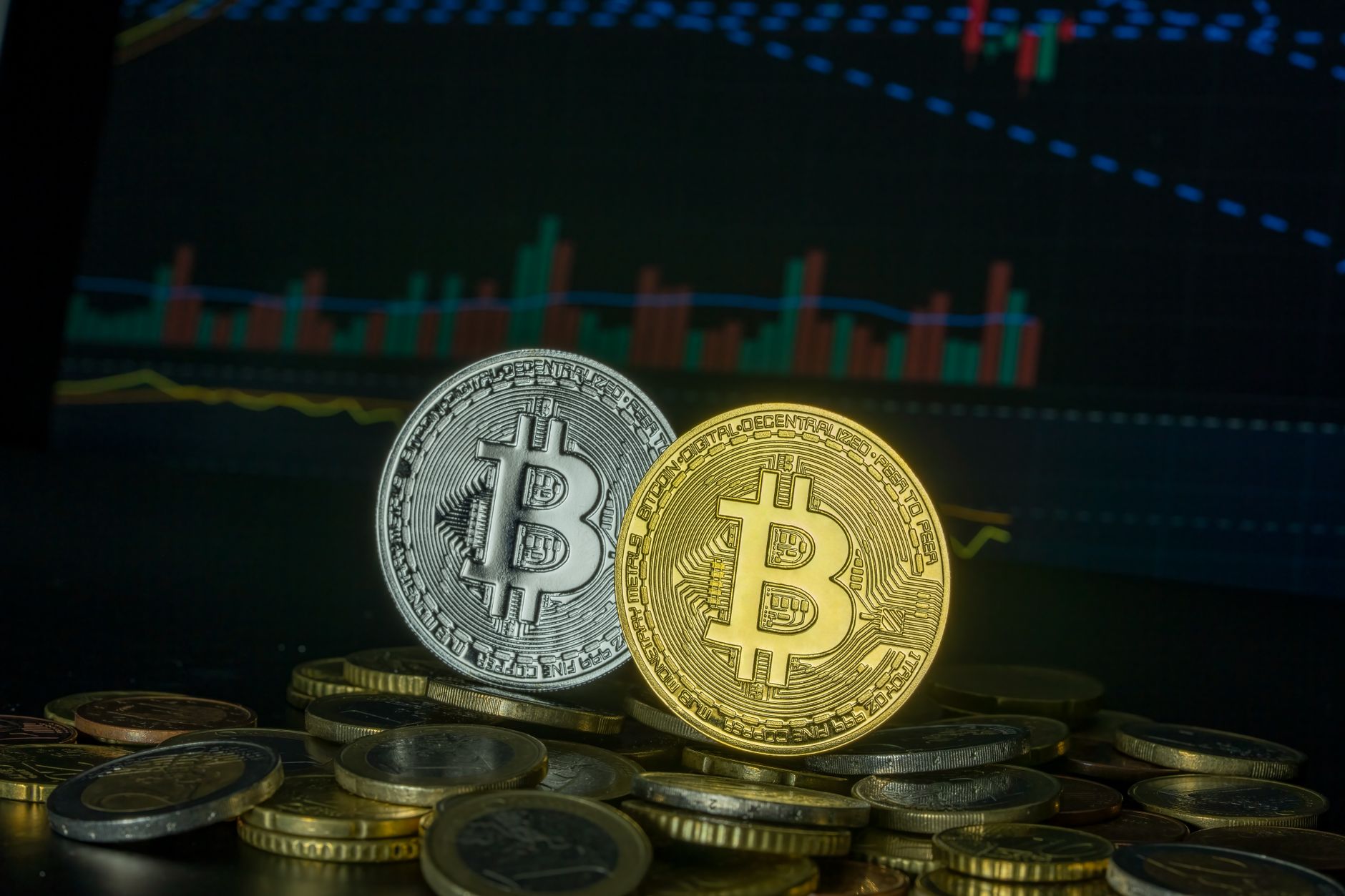 Bitcoin coins on stacked currency with financial graph, symbolizing market trends and investment.