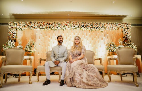 Photo Of Woman Sitting Beside Man 