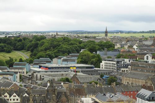 Free A breathtaking panoramic view of Edinburgh's historic and modern architecture from a high vantage point. Stock Photo