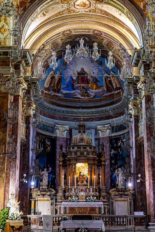 Free Lavish Baroque church interior showcasing ornate altar and vivid ceiling frescoes. Stock Photo