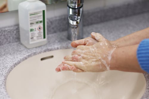 Free A Person Washing Her Hands Stock Photo