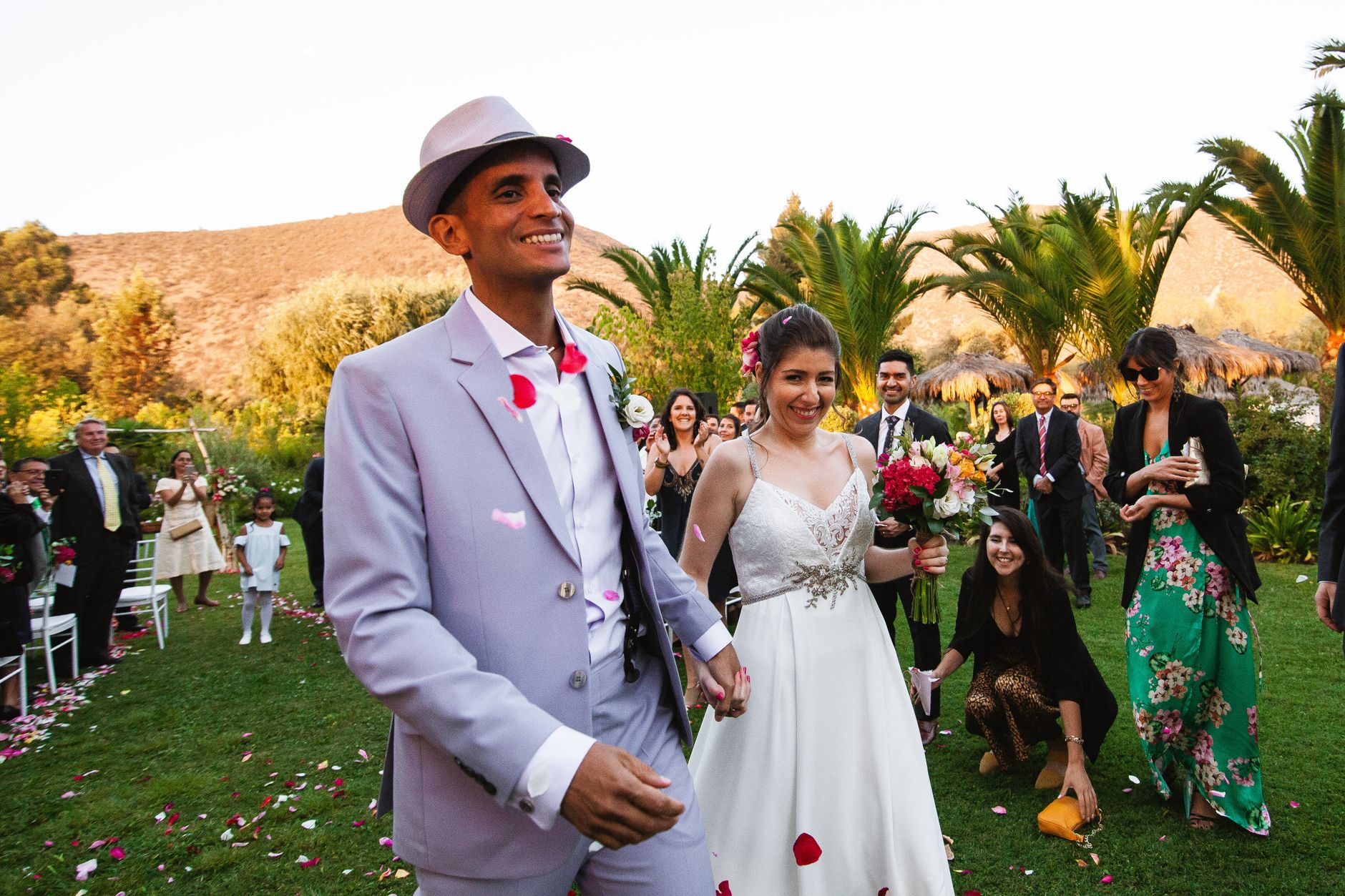 Bride and groom celebrate their outdoor wedding with guests in Calera de Tango, Chile.