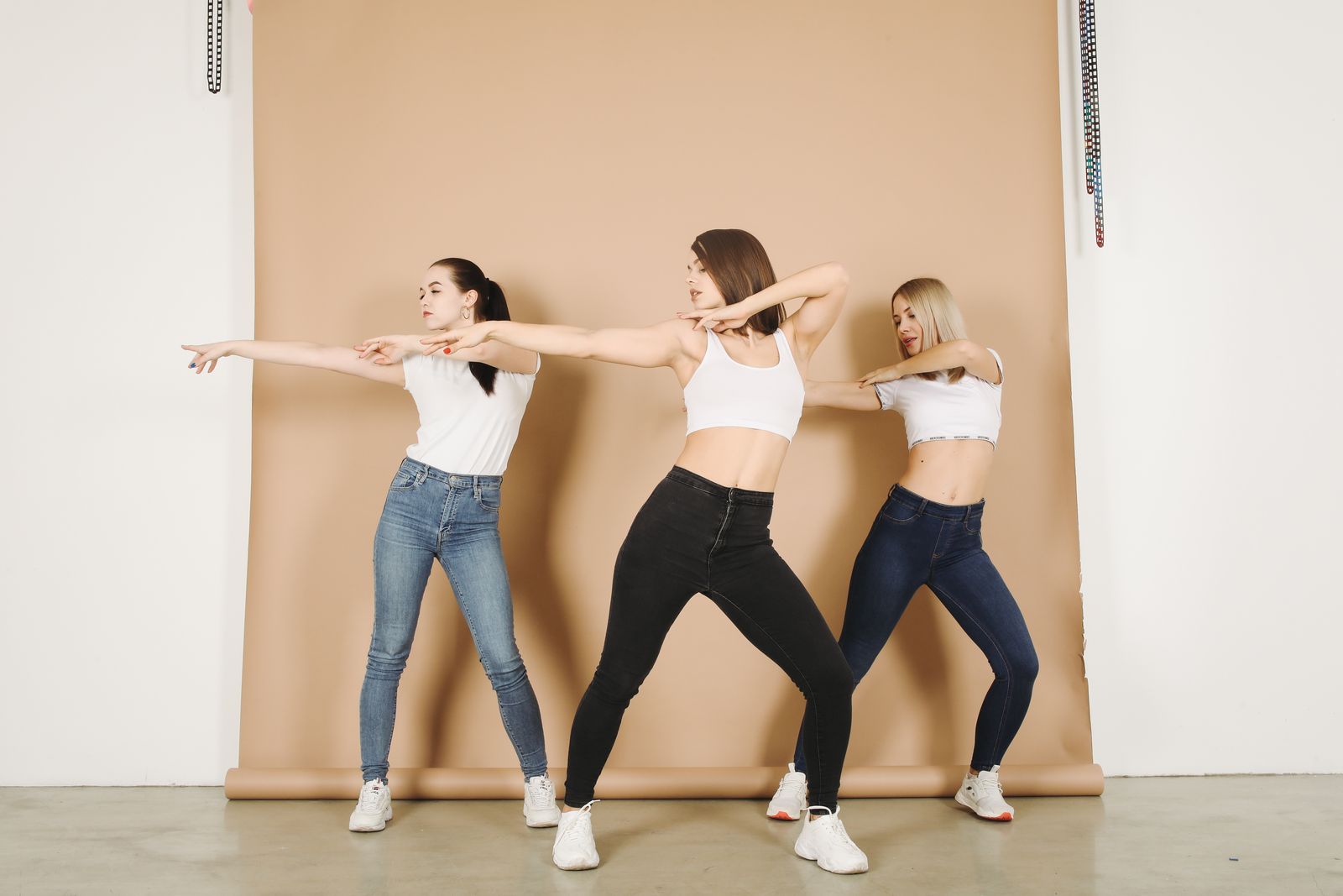Dance fitness class moving together in a studio