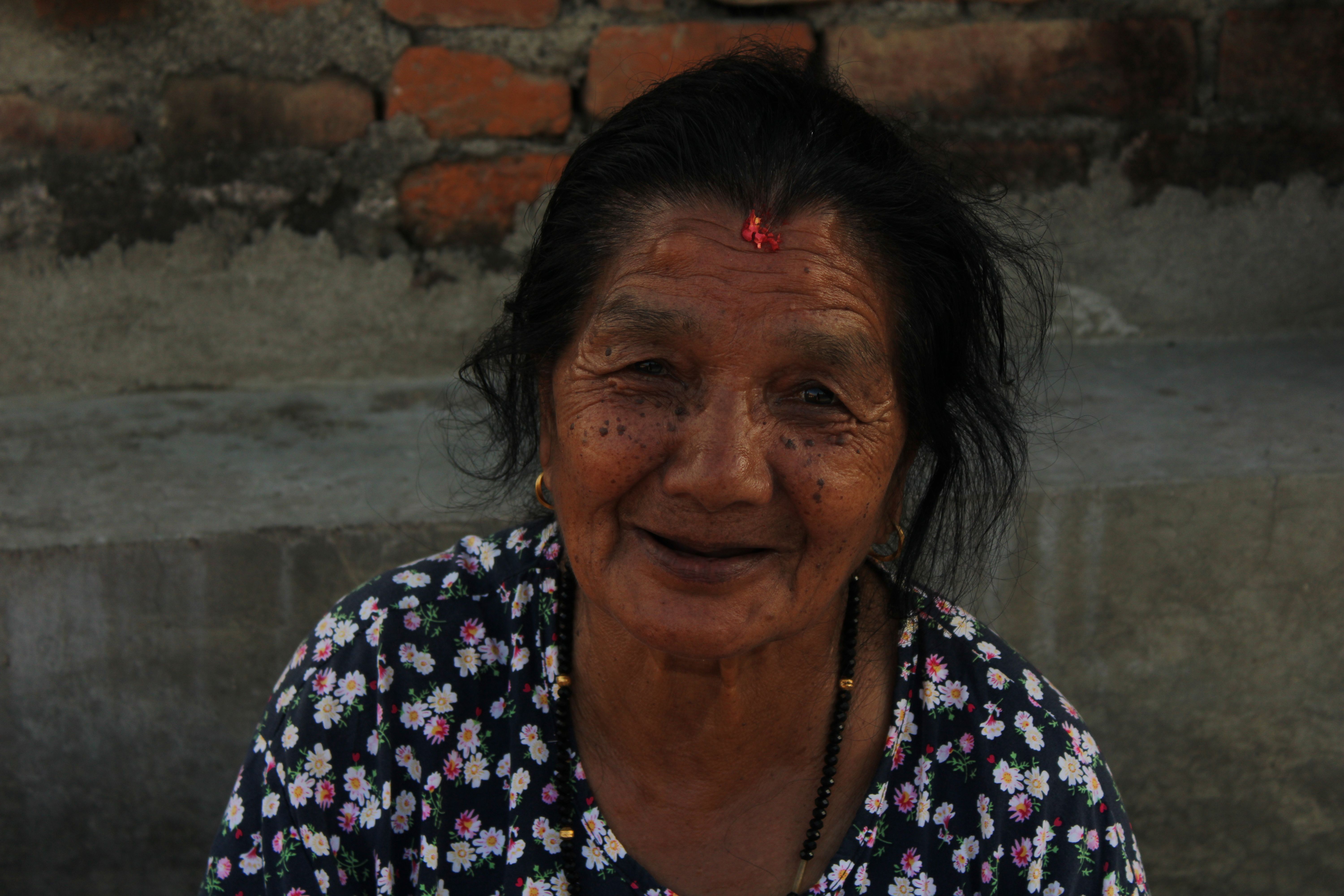 woman applying retinol serum to face at night as part of a sensitive skin routine