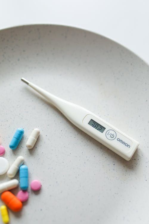 Free Photo Of Digital Thermometer Near Capsules Stock Photo