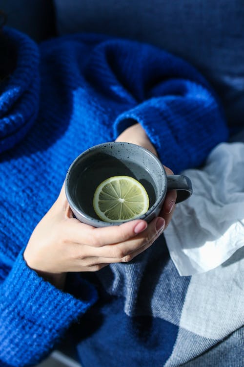 Photo of Person Holding Mug