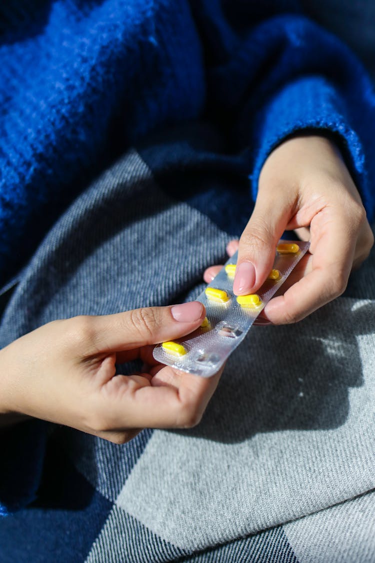 Person Holding Blister Pack