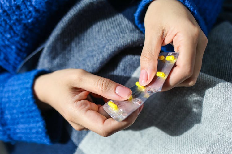 Person Holding Blister Pack