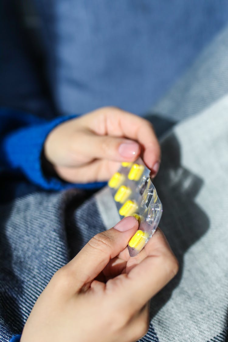 Person Holding Blister Pack