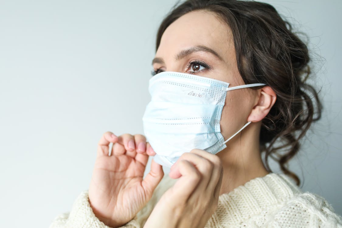 woman wearing face mask for COVID-19