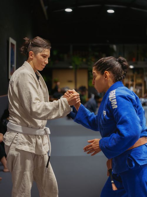 Free Focused jiu-jitsu practitioners engage in a gripping sparring session at a dojo in Buenos Aires. Stock Photo