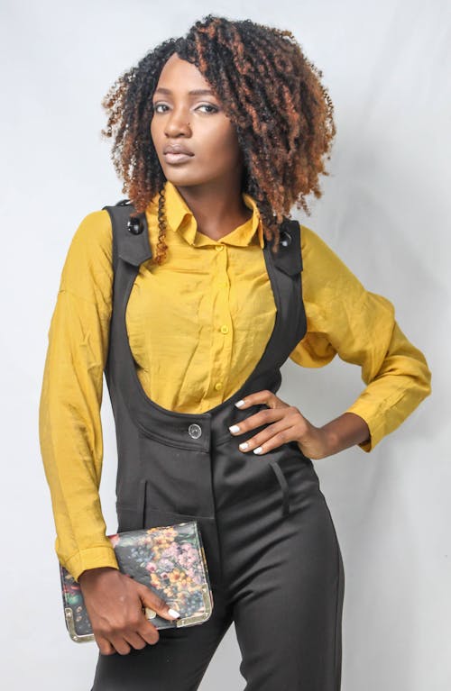 Free Woman in Yellow Shirt and Black Dungaree Stock Photo